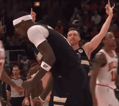 A Basketball Player Wearing A Bp Wristband Celebrates A Victory GIF