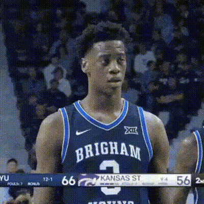 A Basketball Player Wearing A Brigham Jersey Is Standing On The Court . GIF