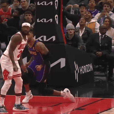 A Basketball Player Wearing A Bulls Jersey Stands On The Court GIF