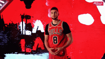 A Basketball Player Wearing A Bulls Jersey With The Number 8 On It GIF