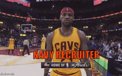 A Basketball Player Wearing A Cavs Jersey Stands In Front Of A Crowd GIF
