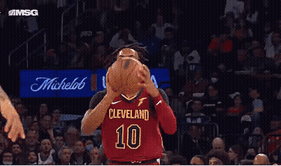 A Basketball Player Wearing A Cleveland 10 Jersey Is About To Shoot The Ball . GIF