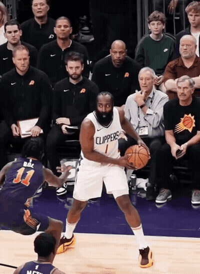 A Basketball Player Wearing A Clippers Jersey Dribbles The Ball GIF