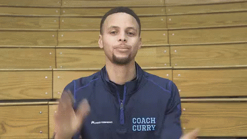 A Basketball Player Wearing A Coach Curry Jacket Is Smiling GIF