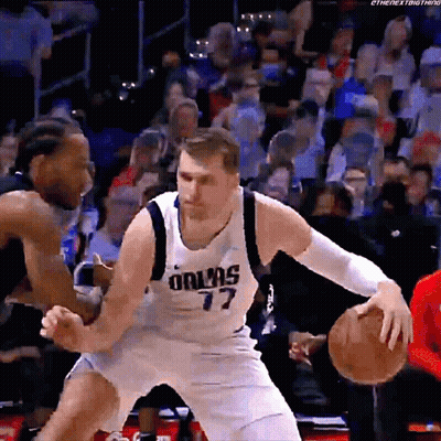 A Basketball Player Wearing A Dallas 77 Jersey GIF
