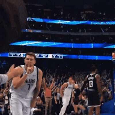 A Basketball Player Wearing A Dallas Jersey Covering His Mouth GIF