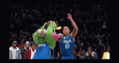 A Basketball Player Wearing A Dallas Jersey Is Going For A Dunk GIF