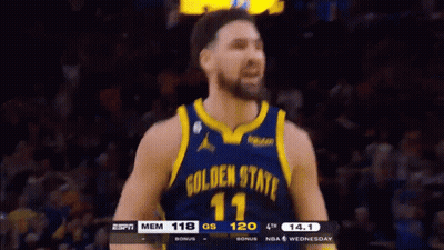 A Basketball Player Wearing A Golden State Warriors Uniform GIF