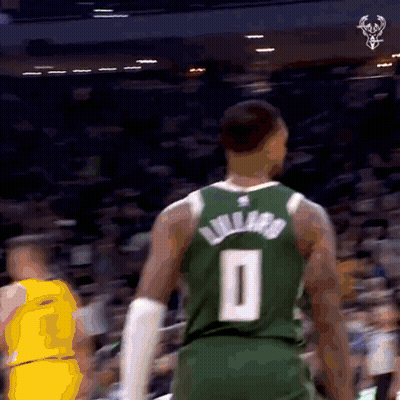 A Basketball Player Wearing A Green Jersey With The Number 0 On It GIF