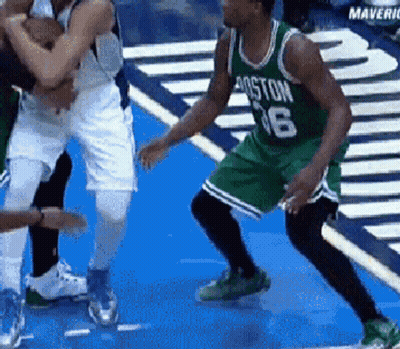 A Basketball Player Wearing A Green Jersey With The Number 16 GIF