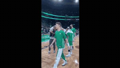 A Basketball Player Wearing A Green Jersey With The Number 26 GIF