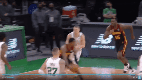 A Basketball Player Wearing A Green Jersey With The Number 27 GIF