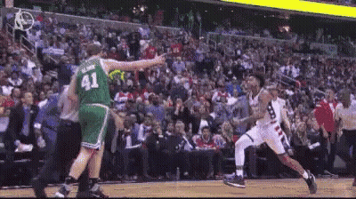 A Basketball Player Wearing A Green Jersey With The Number 41 GIF
