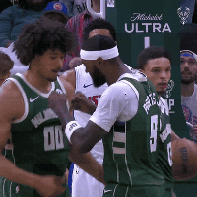A Basketball Player Wearing A Green Jersey With The Number 9 On It GIF