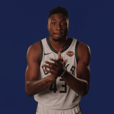 A Basketball Player Wearing A Harley Davidson Jersey GIF