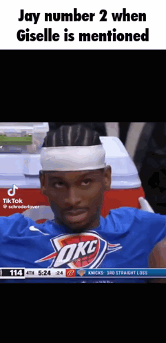 A Basketball Player Wearing A Headband And A Blue Shirt With The Word Okc On It GIF