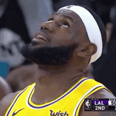 A Basketball Player Wearing A Headband And A Yellow Jersey With Wish On It GIF