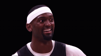 A Basketball Player Wearing A Headband And Smiling With Red Eyes GIF