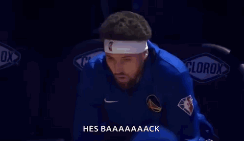 A Basketball Player Wearing A Headband Is Sitting In The Stands At A Game . GIF