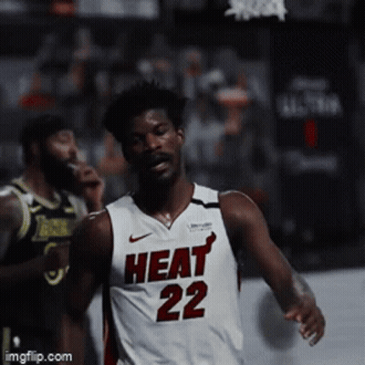 A Basketball Player Wearing A Heat 22 Jersey Runs On The Court GIF