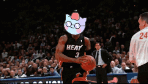 A Basketball Player Wearing A Heat Jersey Is Holding A Basketball GIF