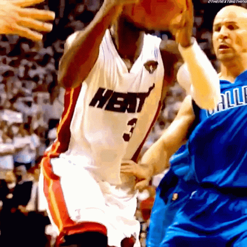 A Basketball Player Wearing A Heat Jersey Shoots A Ball GIF