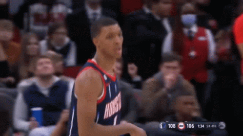 A Basketball Player Wearing A Houston Jersey Stands On The Court GIF
