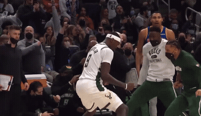 A Basketball Player Wearing A Jersey That Says " Bucks " On It GIF