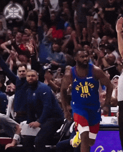 A Basketball Player Wearing A Jersey That Says Denver City GIF