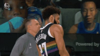 A Basketball Player Wearing A Jersey That Says Freedom GIF