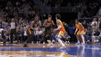 A Basketball Player Wearing A Jersey That Says Hawks Is Dribbling The Ball GIF
