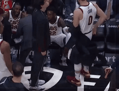 A Basketball Player Wearing A Jersey That Says Love Is Being Helped Off The Court GIF