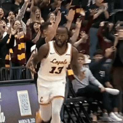 A Basketball Player Wearing A Jersey That Says Loyals 13 GIF