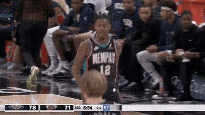 A Basketball Player Wearing A Jersey That Says Memphis GIF