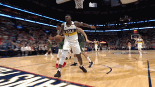 A Basketball Player Wearing A Jersey That Says Nola GIF