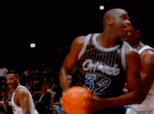A Basketball Player Wearing A Jersey That Says Orlando 32 GIF
