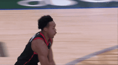 A Basketball Player Wearing A Jersey That Says ' Raptors ' On It GIF