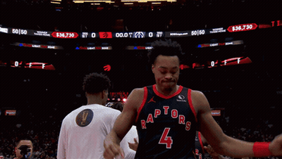 A Basketball Player Wearing A Jersey That Says Raptors On It GIF