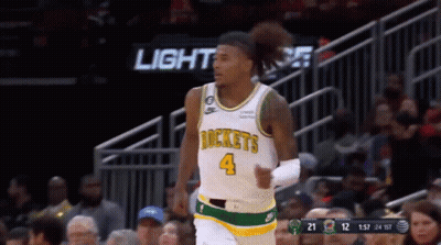 A Basketball Player Wearing A Jersey That Says Rockets GIF
