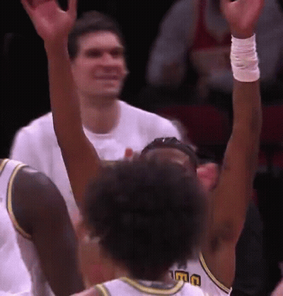 A Basketball Player Wearing A Jersey That Says Uc On It GIF