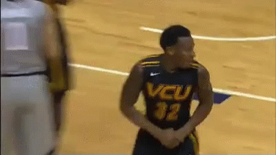 A Basketball Player Wearing A Jersey That Says Vcu On It GIF