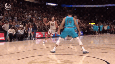 A Basketball Player Wearing A Jersey With The Number 14 On It GIF