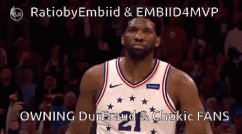 A Basketball Player Wearing A Jersey With The Number 21 On It GIF