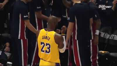 A Basketball Player Wearing A Jersey With The Number 23 On It GIF