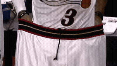 A Basketball Player Wearing A Jersey With The Number 3 On It GIF