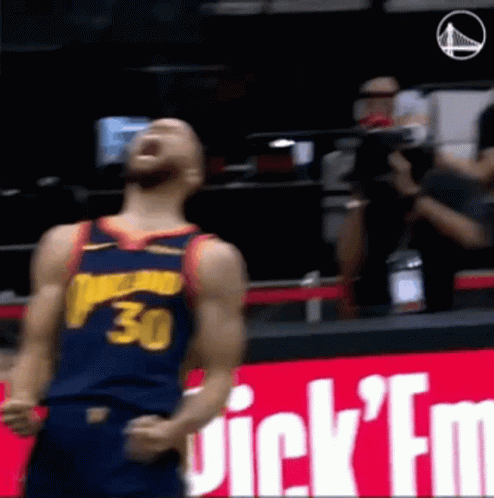 A Basketball Player Wearing A Jersey With The Number 30 On It Is Standing On The Court . GIF