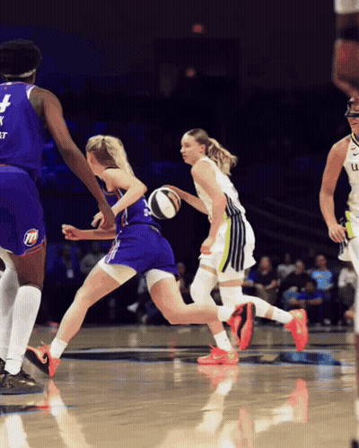 A Basketball Player Wearing A Jersey With The Number 4 On It Is Dribbling The Ball GIF