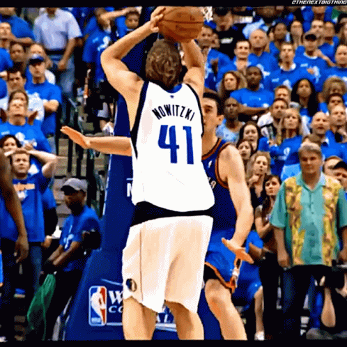 A Basketball Player Wearing A Jersey With The Number 41 GIF