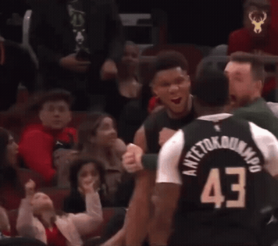 A Basketball Player Wearing A Jersey With The Number 43 On It Is Talking To Another Player . GIF