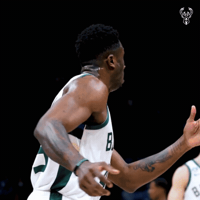 A Basketball Player Wearing A Jersey With The Number 8 On It GIF